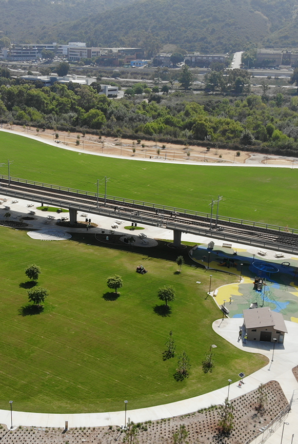 Aerial image a grassy sitting area and a recreation field.